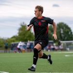 Junior forward Devin Livingstone runs in open space on the soccer field