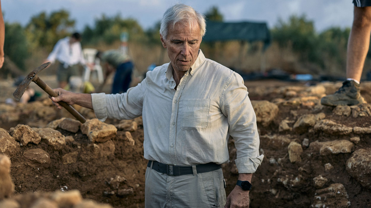 Michael Cosmopoulos standing in a trench at Iklaina