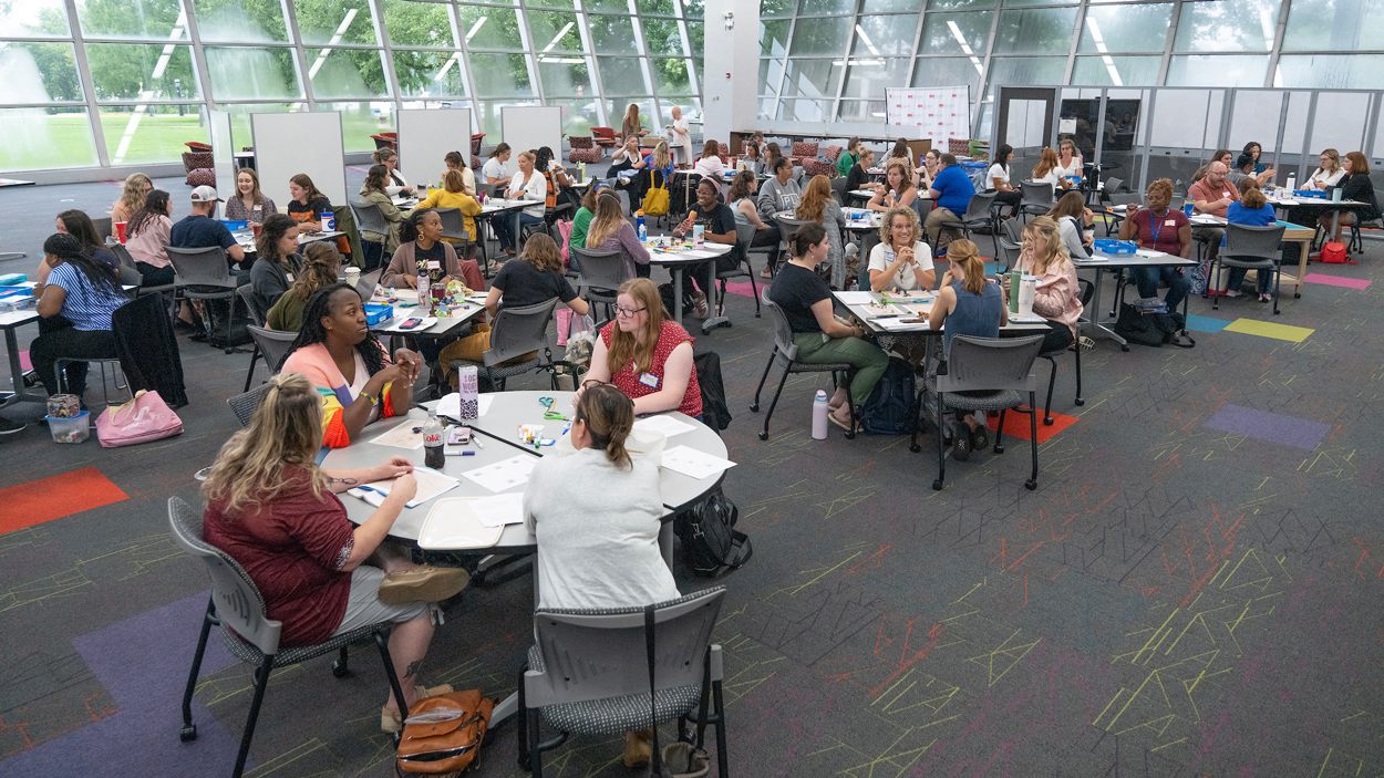 Educators work during a counseling conference at UMSL