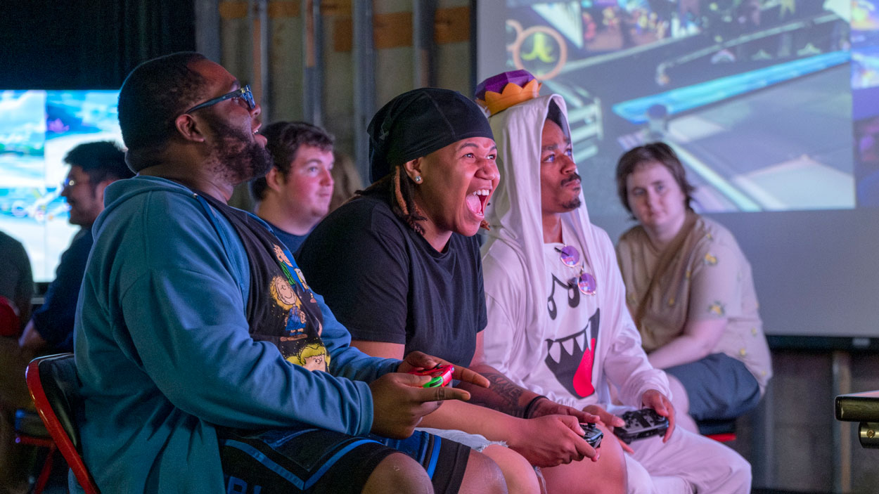 From left, education major Wu Stegall, computer science major Jaylen Ellis and graphic design major Daniel Miller competed in the University of Missouri–St. Louis Esports team's Mario Kart Star Cup Tournament last Wednesday in the Esports Arena in the Millennium Student Center.