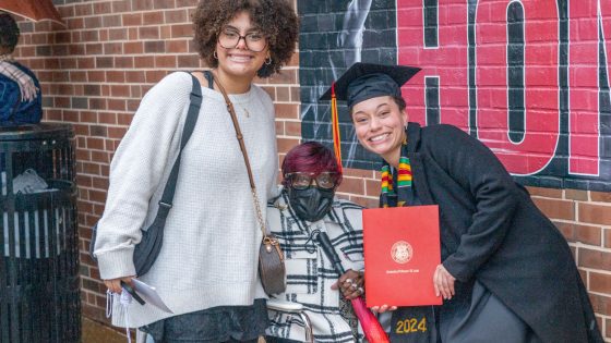 Addi Nunnelly taking photos with family members after commencement