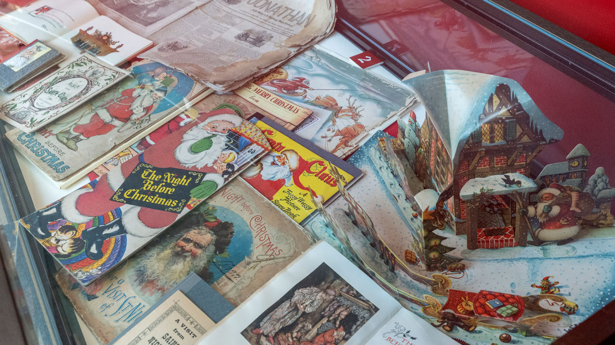 Printed versions of "The Night Before Christmas" sit in a display case in the St. Louis Mercantile Library's Shopmaker Print Gallery on the campus of the University of Missouri–St. Louis.