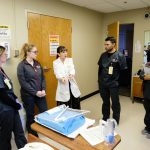 Students in the College of Nursing speak with instructor