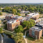 Aerial view of the UMSL Science Complex with the St. Louis downtown skyline visible in the distance