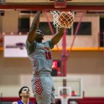 Emanuel Prospere II dunks a basketball