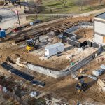 An aerial view of construction of the Richter Family Welcome and Alumni Center