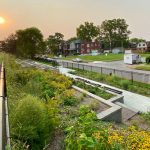 The sun sets over The Green House Venture's Embankment Greenway along Interstate 44 in St. Louis.