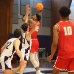 Troy Glover II shoots over a Truman State defender