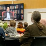 Attendees at the Bellerive anniversary celebration watch a screening of the UTV documentary