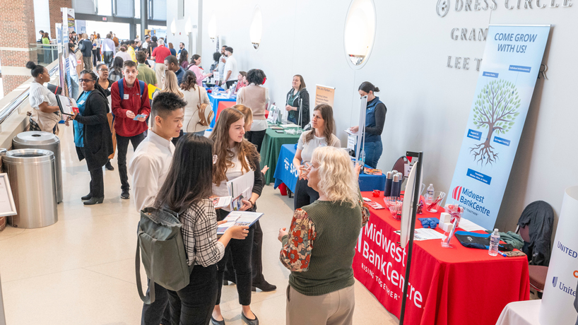 Students talk with employers.