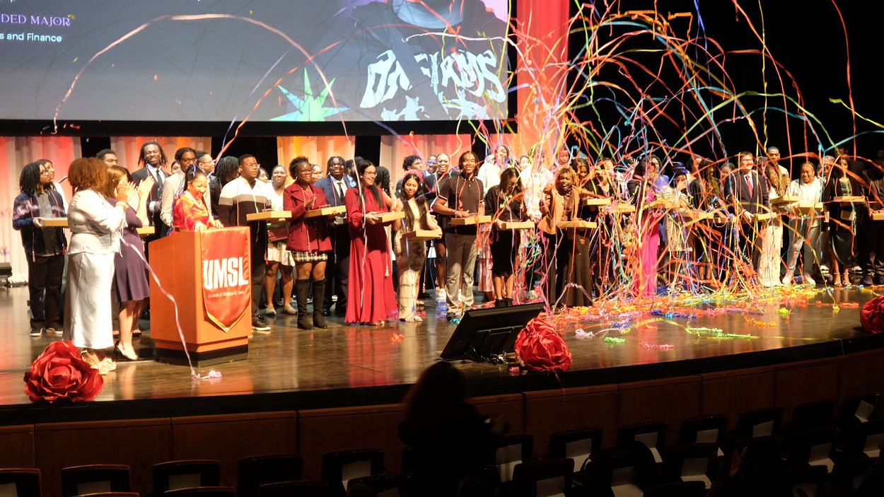 Streamers fall on members of the senior class of students in UMSL's Bridge Program Saturday Academy at its annual Award Ceremony on Saturday at the Blanche M. Touhill Performing Arts Center