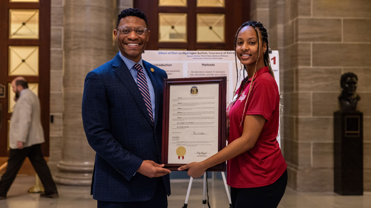 UMSL biology student Kyliyah Walker with Missouri Sen. Brian Williams at UM System's Undergraduate Research Day at the Missouri Capitol