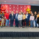 UMSL employees marking their five-year anniversaries stand on stage in the Century Rooms of the Millennium Student Center
