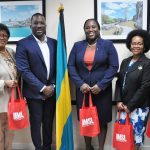 Vice Chancellor Reggie Hill stands with Chilean Burrows and other members of The Bahamas Ministry of Education and Technical and Vocational Training