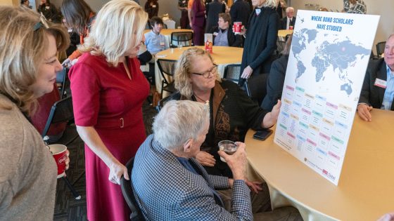 Chancellor Kristin Sobolik shows Sen. Christopher "Kit" Bond a map of where Bond International Scholars have studied abroad since the program was launched in 2018.