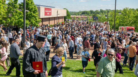 New graduates gathered with their family and friends outside the Mark Twain Athletic Center on Saturday