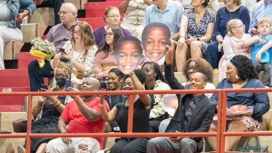 Family members and friends show their support for one of the graduates during Saturday afternoon's ceremony for the College of Arts and Sciences and School of Social Work