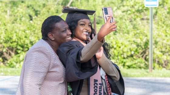 Finance and accounting graduate Cynthia Mungai takes a selfie with her mother, Beatrice Mungai, on Friday evening.
