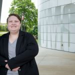 Kel Gruber stands outside the Recreation and Wellness Center