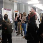 Students fill the first-floor hallway at Benton Hall during the Midwest Ecology and Evolution Conference