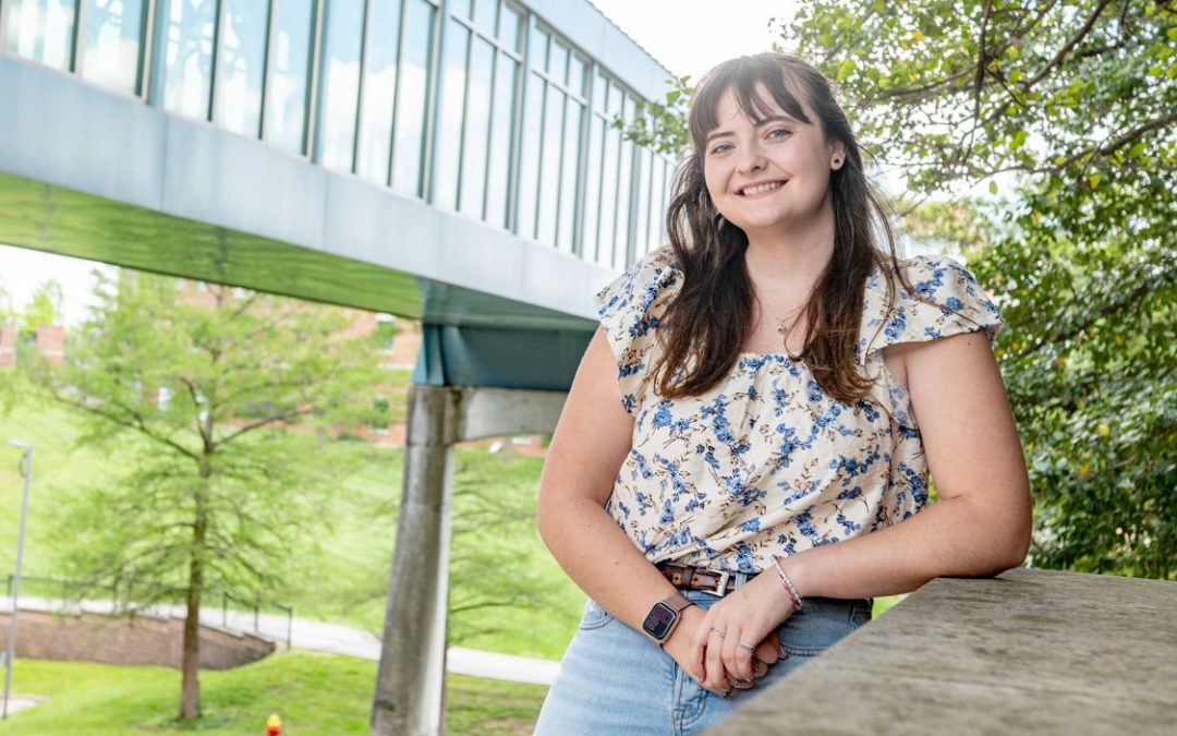 Sociology graduate Sophie Heinz taking part in commencement 21 years after her father missed his opportunity because of military service
