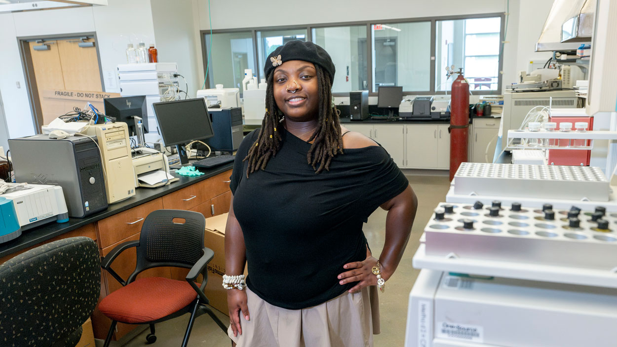 Zahria Patrick stands in a chemistry lab