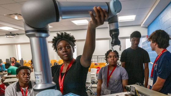Hazelwood West High School student Jay'Lah Grady works on programing a 6 axis collaborative robotic arm