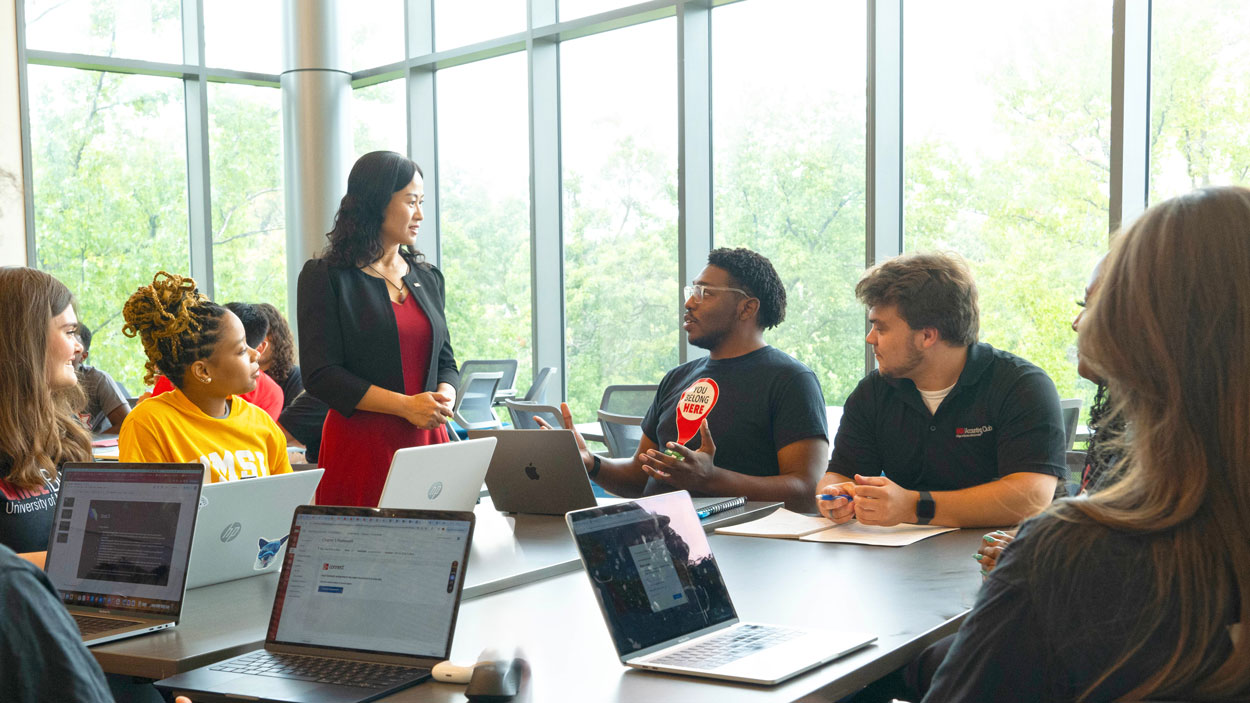 UMSL Business students speak with Curators' Distinguished Professor of Finance Gaiyan Zhang