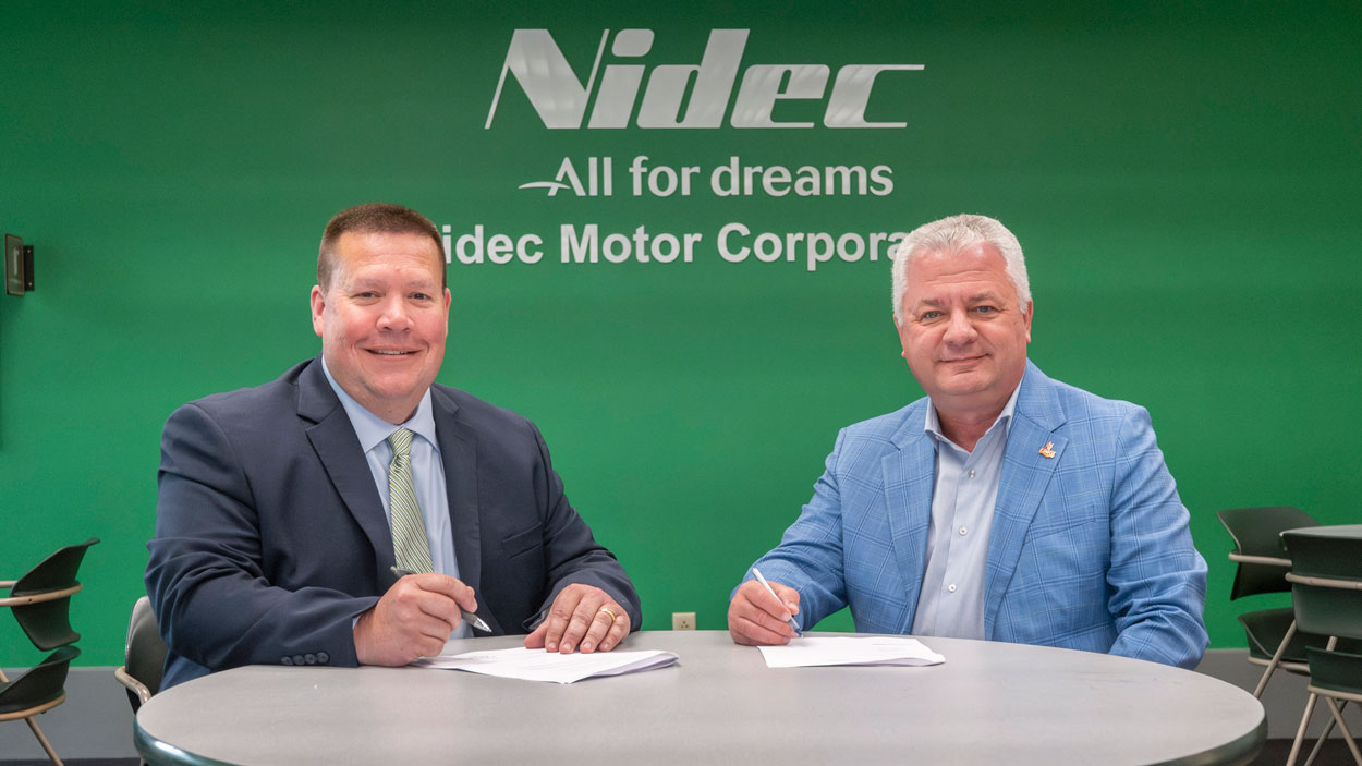Ryan Murphy, president of Nidec Americas Holding Corporation, and UMSL Provost Steven J. Berberich sign a memorandum of understanding to formalize the partnership between the company and the university