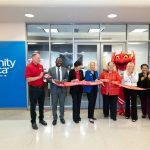 Chancellor Kristin Sobolik cuts a ribbon to mark the opening CommunityAmerica Credit Union's new branch in the Millennium Student Center
