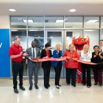 Chancellor Kristin Sobolik cuts a ribbon to mark the opening CommunityAmerica Credit Union's new branch in the Millennium Student Center
