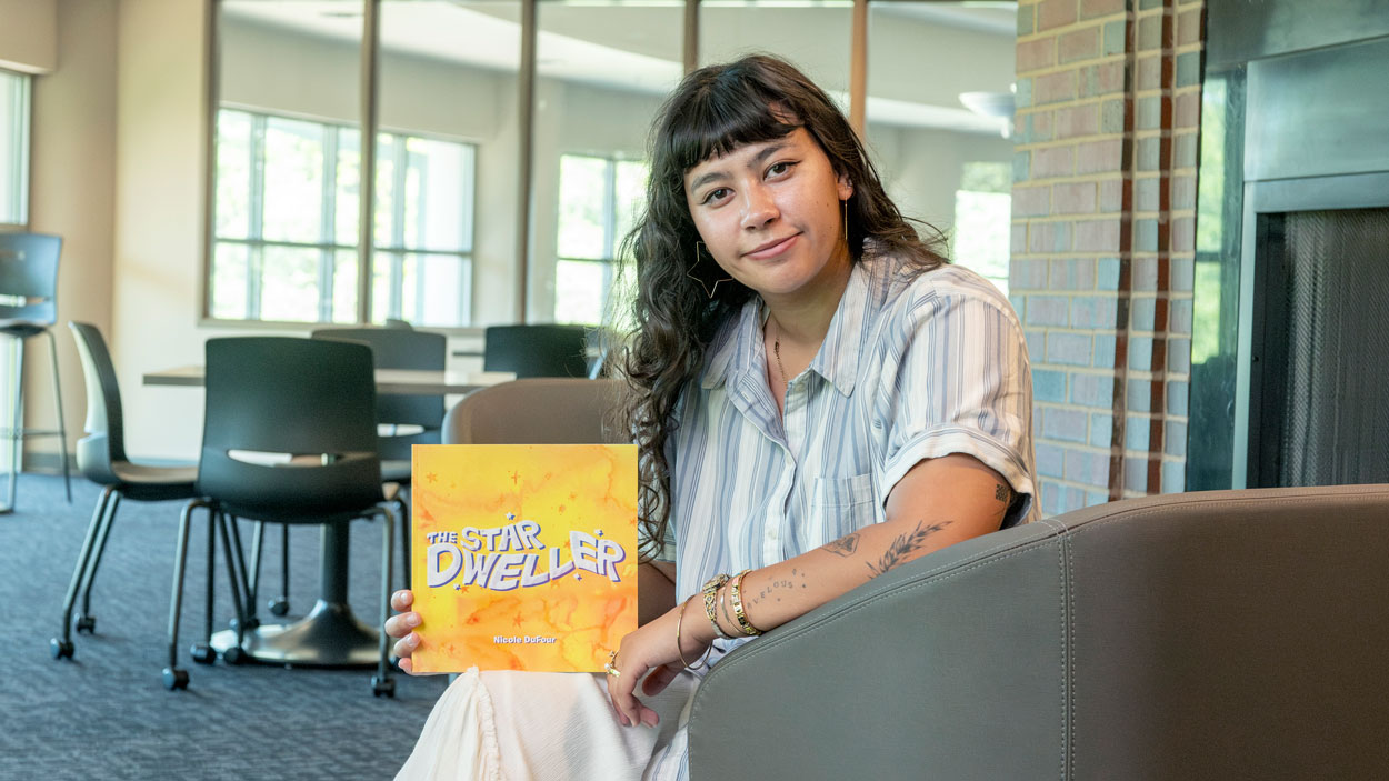 UMSL alum Nicole DuFour with her book, The Star Dweller