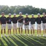 UMSL's men's golf team posing with the Arch Cup after winning the tournament at Gateway National Golf Links