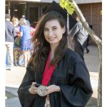 Isabelle Hermann poses with her commencement medal