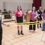 Bethany Worrell, leads music students in Anatomy in the round: Acting out the Larynx. Students were each assigned a role to play to make a human size model of the larynx. The goal of the lesson was to illustrate how their voice system functions.