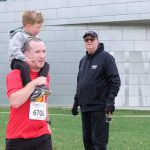 Samuel Fredeking runs in the UMSL 5K in 2023