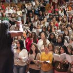 Maria A. Ellis directs a group of high school singers during Acappellooza Fall on Sept. 24 at the Blanche M. Touhill Performing Arts Center