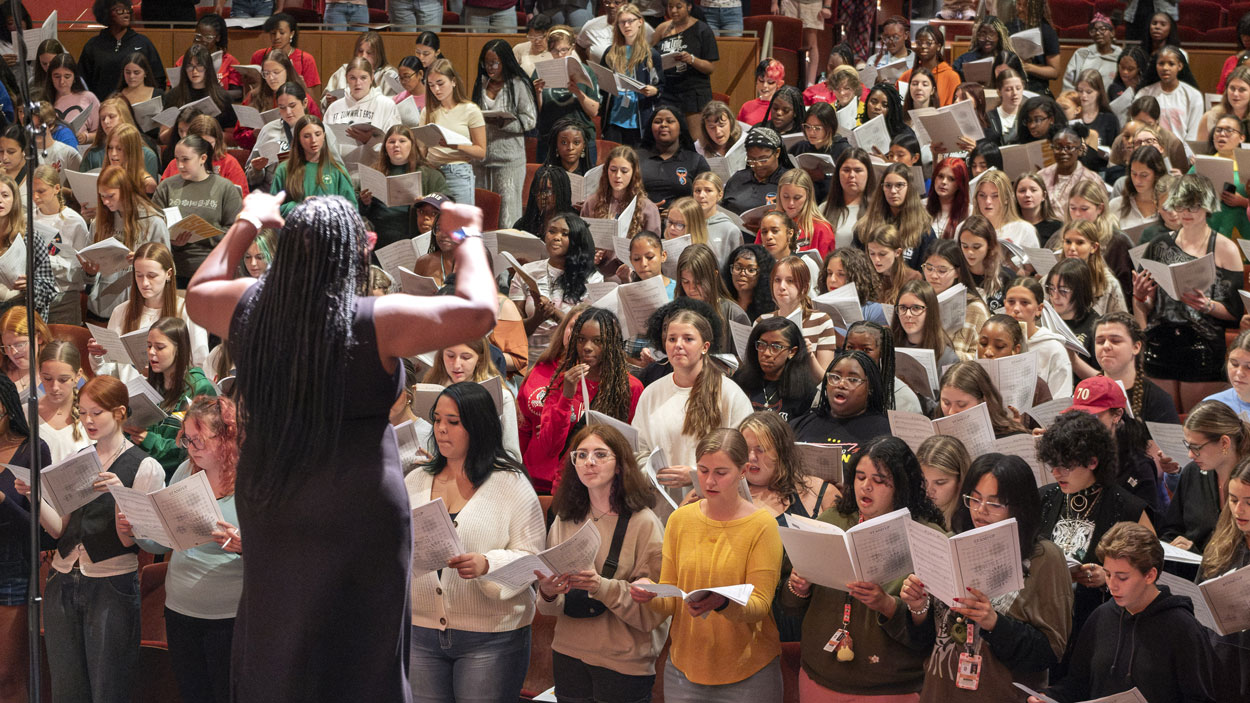Maria A. Ellis directs a group of high school singers during Acappellooza Fall on Sept. 24 at the Blanche M. Touhill Performing Arts Center