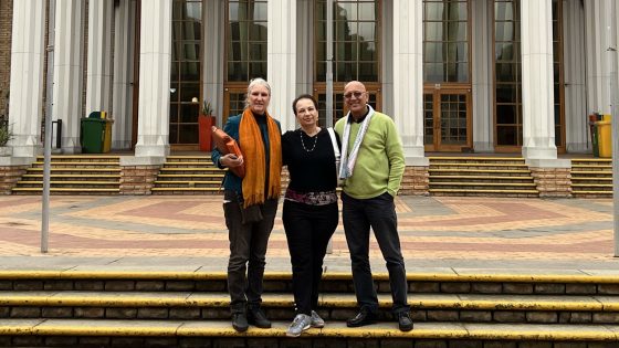 Associate Professor Alina Slapac with collaborator Karen Collett and Umesh Bawa on the campus of the University of the Western Cape in South Africa