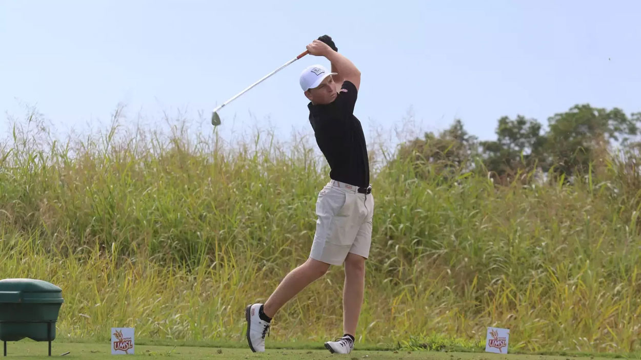 Golfer Benjamin yBerger follows through after hitting an iron shot