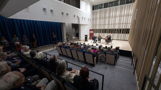 Guests listen in the seats of the Arianna String Quartet Recital Hall as the group performs during Tuesday's opening.