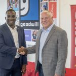 UMSL Vice Chancellor Reggie Hill shakes hands with MERS Goodwill President and CEO Mark Arens after signing a partnership agreement that will provide educational and professional development opportunities for MERS Goodwill employees through UMSL's Advanced Workforce Center.