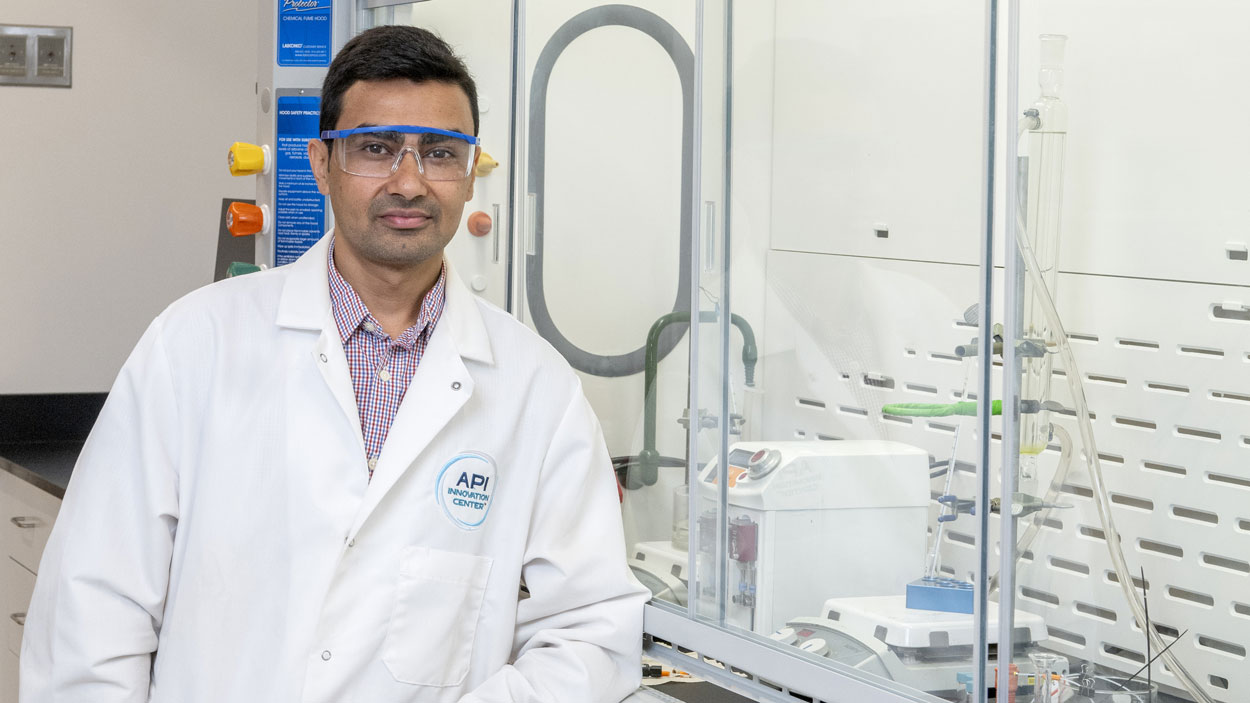 Chemistry alum Saroj Kafle in API Innovation Center's Research and Development Lab