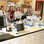 Curators' Distinguished Professor Michael Nichols talks to a group of prospective students as they tour some of UMSL chemistry facilities during a Science and Engineering Day event on Oct. 17