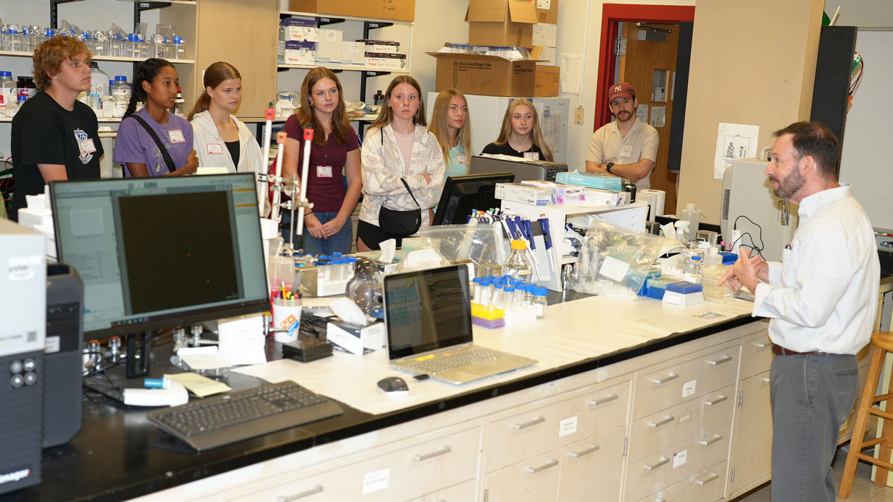 Curators' Distinguished Professor Michael Nichols talks to a group of prospective students as they tour some of UMSL chemistry facilities during a Science and Engineering Day event on Oct. 17