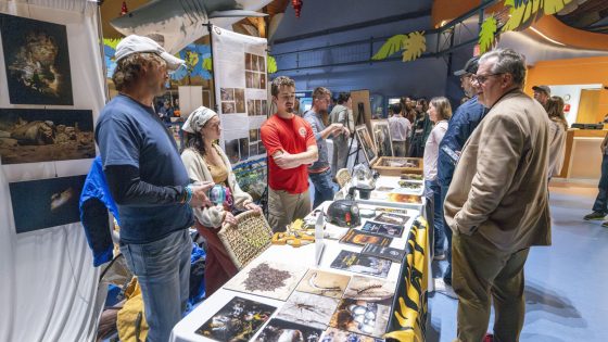 Members of Meramec Valley Grotto and Southeast Missouri grotto speak with guests about caves and cave conservation at the Whitney and Anna Harris Conservation Forum