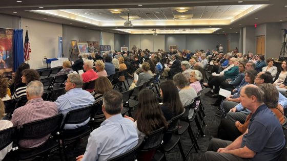 Attendees listen to one of the speakers at a celebration of "Kyklos – Circle of Glory"