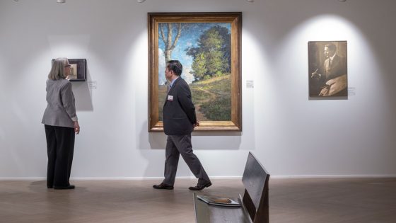 Julie Dunn-Morton leads President Mun Choi on a tour of the new Wallace H. Smith Gallery of Art