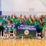 Coach Ryan Young and members of the UMSL volleyball team celebrate the program's first-ever GLVC Tournament title