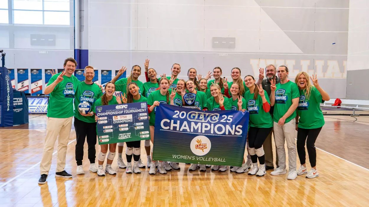 Coach Ryan Young and members of the UMSL volleyball team celebrate the program's first-ever GLVC Tournament title